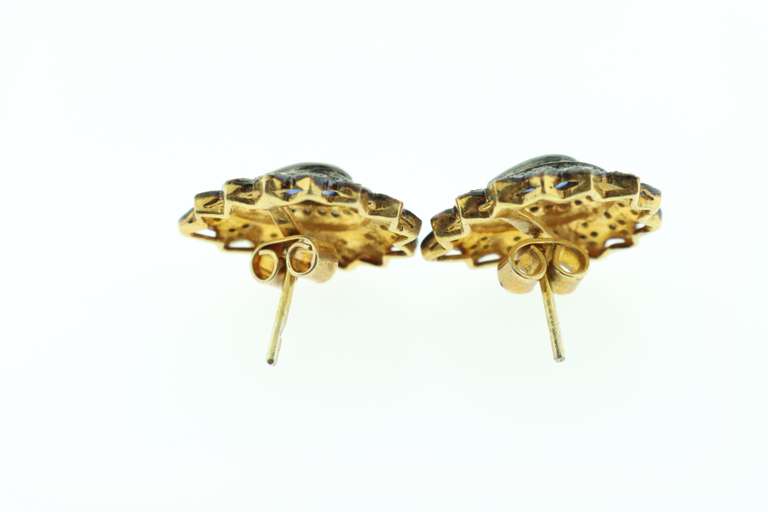 Intricate Teardrop Sapphire Earrings with Elegant Dark Silver Backdrop and Diamond Accents