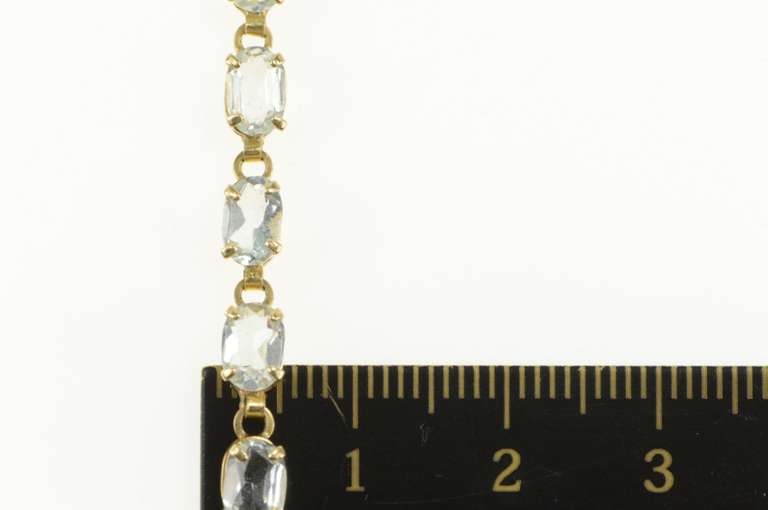 14K Yellow Gold Oval Sim. Blue Topaz Classic Tennis Bracelet