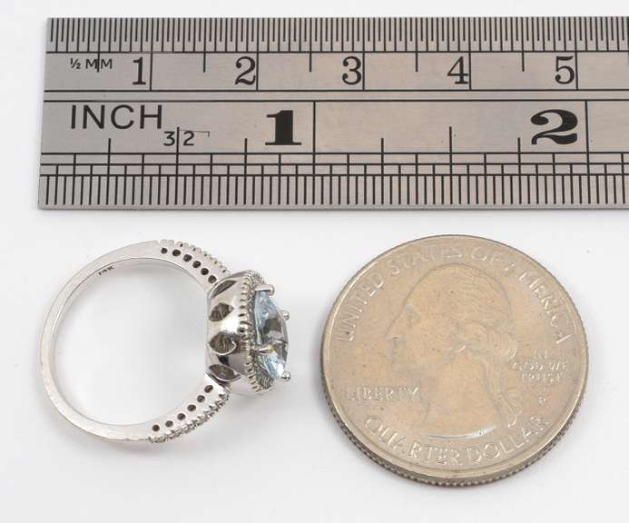 Modern Aquamaring Ring with a Halo of Diamonds