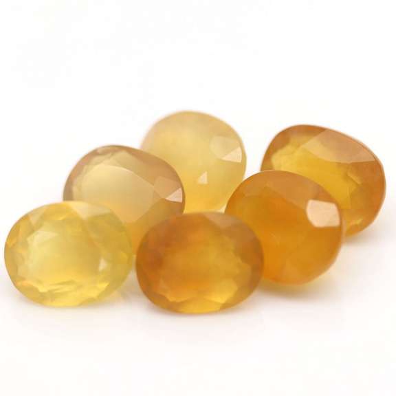 Glistening 25.71ct natural golden Fire Opal set