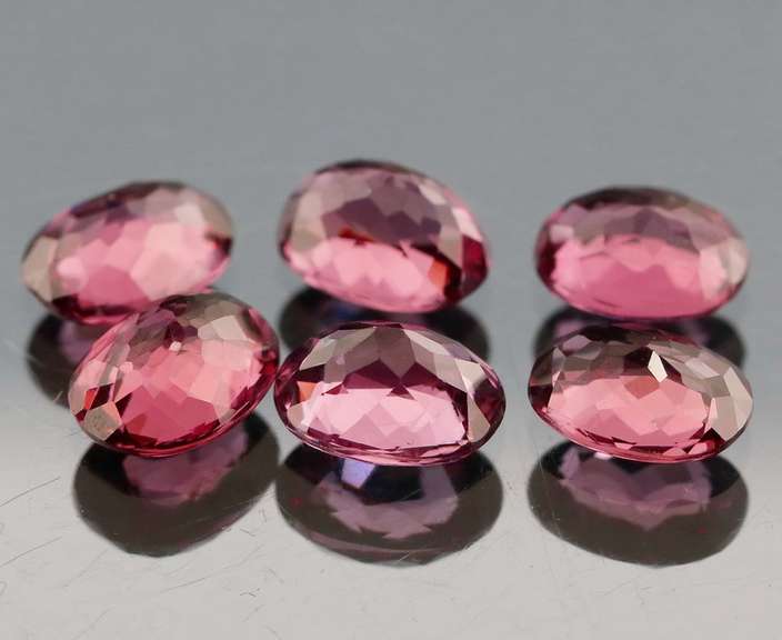 Remarkable 9.53ct violet pink Rhodolite Garnet set