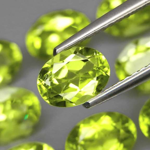 Dazzling 7.85ct untreated apple green Peridot set