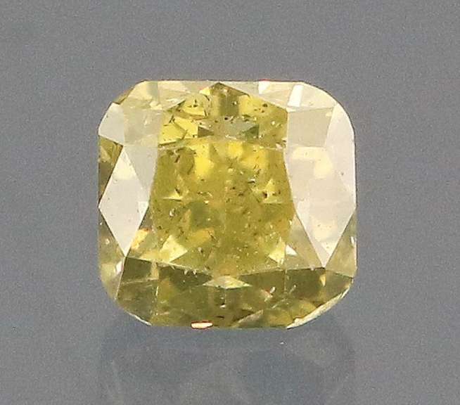 Sparkling .20ct cushion cut yellow Diamond