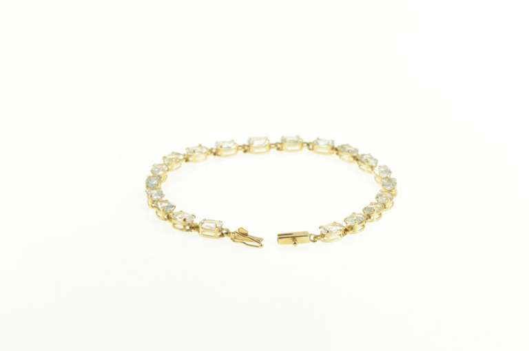 14K Yellow Gold Oval Sim. Blue Topaz Classic Tennis Bracelet