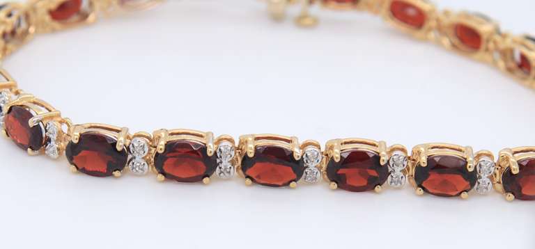 Majestic Yellow Gold oval Garnet and Diamond Tennis Bracelet