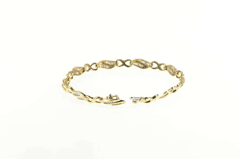 10K Yellow Gold 1.25 Ctw Baguette Diamond Wavy Tennis Bracelet