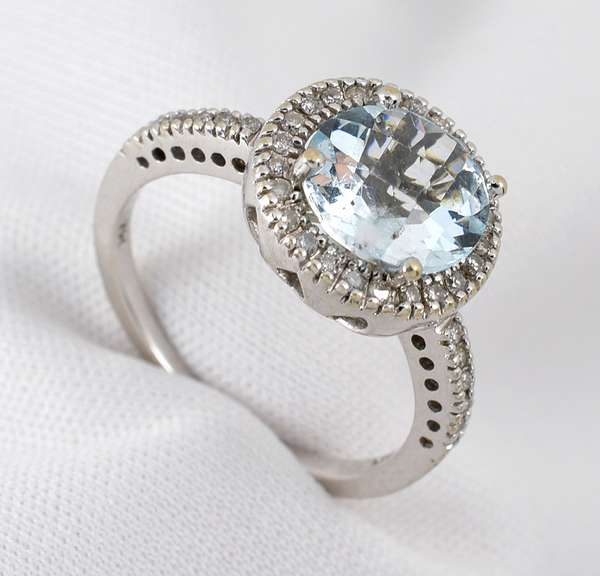 Modern Aquamaring Ring with a Halo of Diamonds