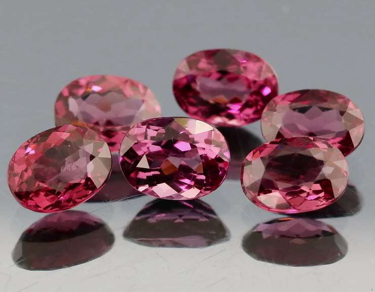 Remarkable 9.53ct violet pink Rhodolite Garnet set