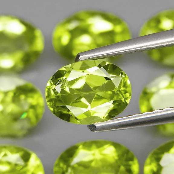 Dazzling 7.64ct untreated apple green Peridot set