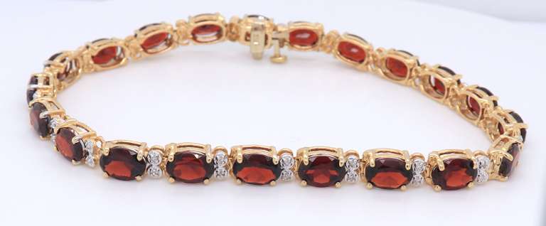 Majestic Yellow Gold oval Garnet and Diamond Tennis Bracelet