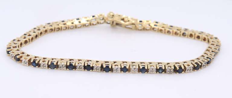 Ideal Yellow Gold Blue Sapphire and Diamond Tennis Bracelet