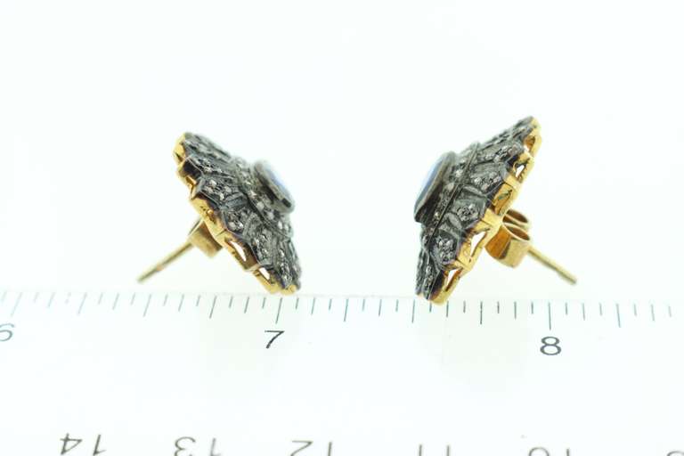 Intricate Teardrop Sapphire Earrings with Elegant Dark Silver Backdrop and Diamond Accents