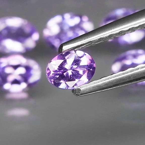 Heavy flashing 4.43ct oval cut Tanzanite set