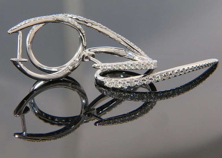 Stylish Swirl Earrings in White Gold with Diamonds