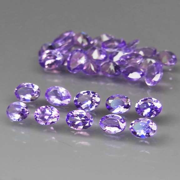 Heavy flashing 4.43ct oval cut Tanzanite set