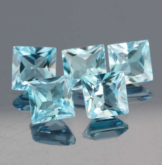 Vivid! 14.09ct radiant cut sky blue Topaz set