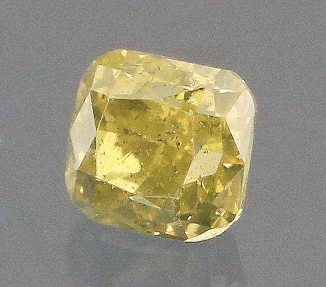 Sparkling .20ct cushion cut yellow Diamond