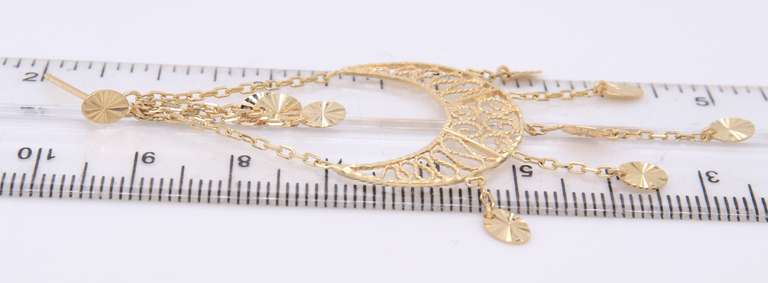 Charming Yellow Gold Diamond Cut Dangle Earrings