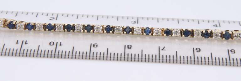 Ideal Yellow Gold Blue Sapphire and Diamond Tennis Bracelet