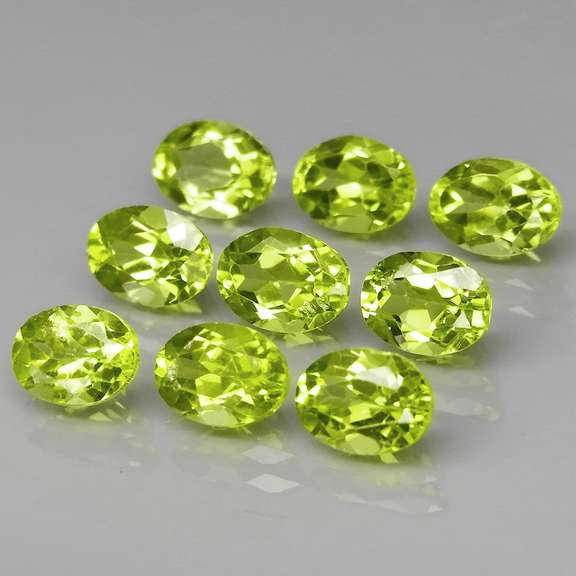 Dazzling 7.64ct untreated apple green Peridot set