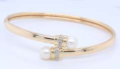 Elegant Yellow Gold Pearl and Diamond Bypass Bracelet