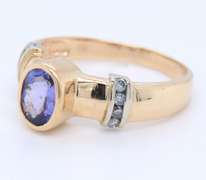 Powerful Yellow Gold Tanzanite Bezel Set and Diamond Side Ring