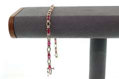 LADIES RUBIES AND DIAMOND GOLD BRACELET.