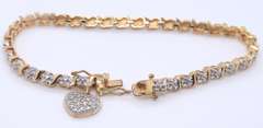 Sterling Silver Cubic Zirconia Tennis Bracelet with Heart Shaped Charm