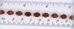 Majestic Yellow Gold oval Garnet and Diamond Tennis Bracelet