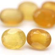 Glistening 25.71ct natural golden Fire Opal set