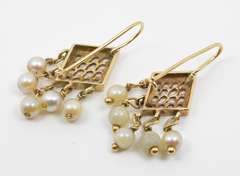 Tasteful Dangling Pearl Earrings in 14K Yellow Gold