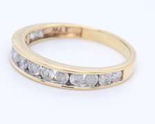 Graceful Yellow Gold Channel Set Diamond Band