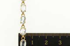 14K Yellow Gold Oval Sim. Blue Topaz Classic Tennis Bracelet