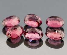 Remarkable 9.53ct violet pink Rhodolite Garnet set
