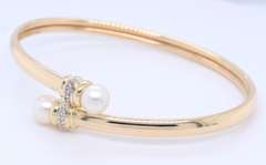 Elegant Yellow Gold Pearl and Diamond Bypass Bracelet