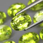 Dazzling 7.85ct untreated apple green Peridot set