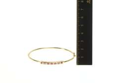 14K Yellow Gold 0.75 Ctw Ruby Diamond Inset Oval Bangle Bracelet
