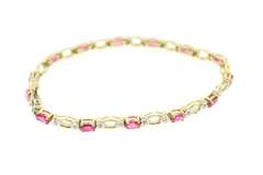 LADIES RUBIES AND DIAMOND GOLD BRACELET.