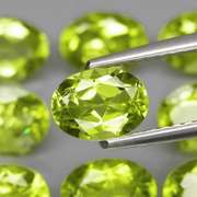 Dazzling 7.64ct untreated apple green Peridot set