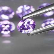 Heavy flashing 4.43ct oval cut Tanzanite set