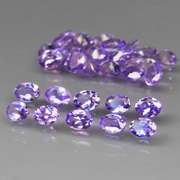 Heavy flashing 4.43ct oval cut Tanzanite set