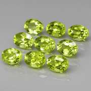 Dazzling 7.64ct untreated apple green Peridot set