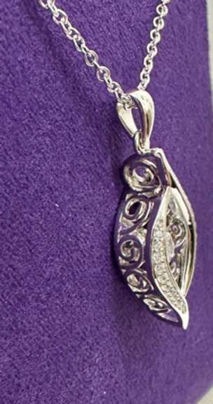 Platinum over 925 non Tarnish Sterling Silver with dancing simulated Stone