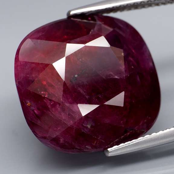 Swirling multi-color 27.85ct cushion cut Ruby