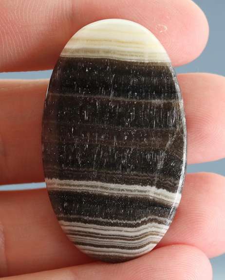 Well defined 54.90ct banded Rhodochrosite Agate