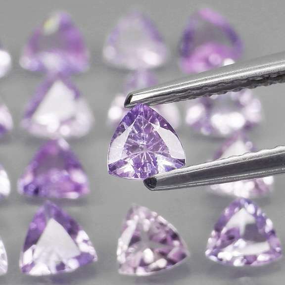 Glittering 3.57ct trillion cut Tanzanite set
