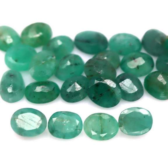 Oval cut 8.56ct Zambian Emerald set