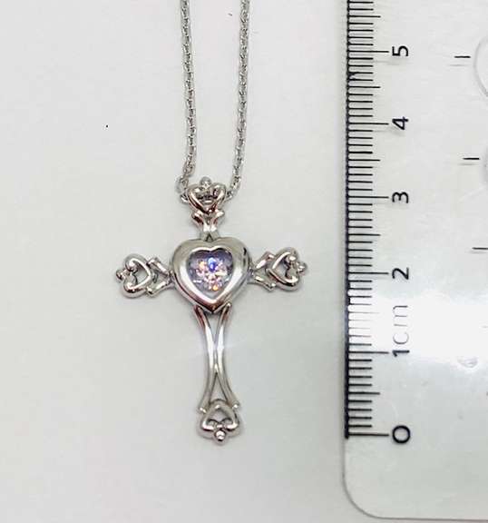 Platinum over 925 non Tarnish sterling silver Pendant with center dancing stone.