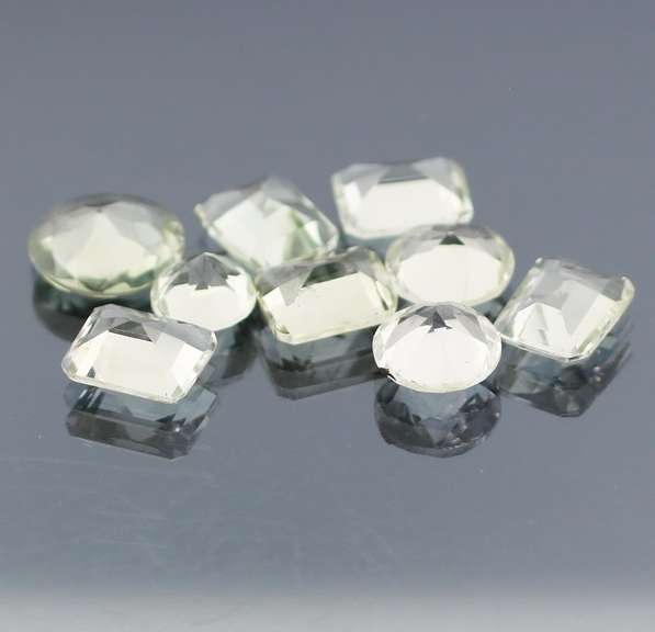 Gem grade 25.88ct multi-faceted green Quartz set