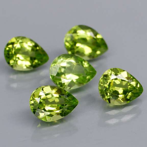 Dazzling 6.02ct untreated apple green Peridot set